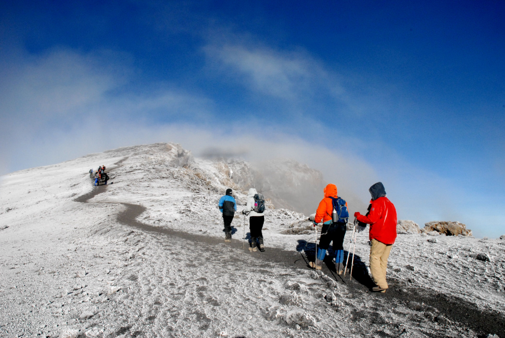 uhuru-peak-hiking-mount-kilimanjaro-tanzania-safaris-tours